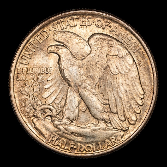 1945 half dollar FS-401 Sunburst variety showing radiating die stress crack lines from Liberty's shoulder on the obverse